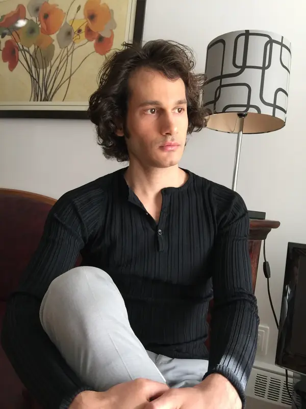 Aviv Yeshayav at 30, seated in an armchair
